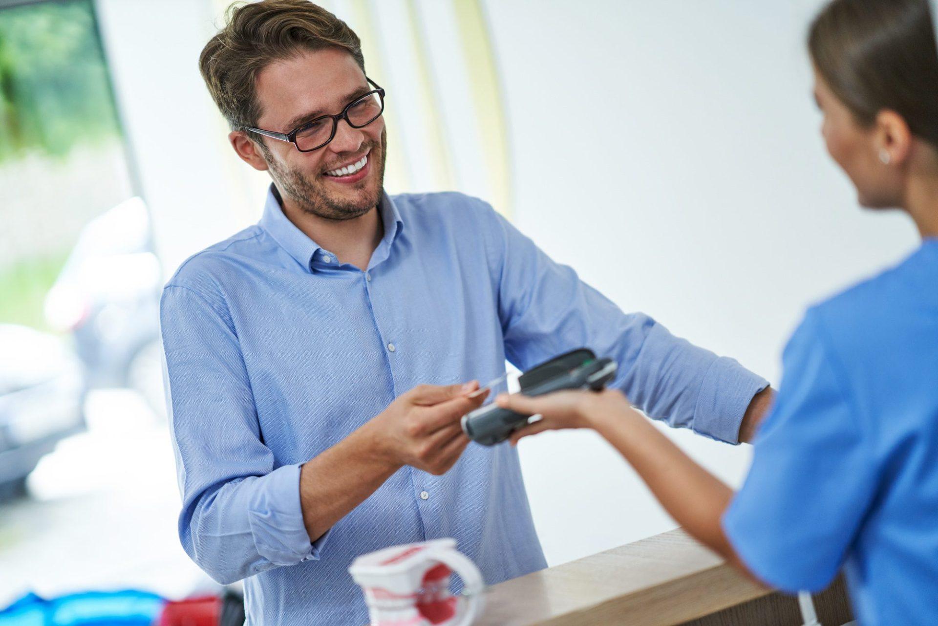patient paying for dental visit in clinic 1 patient paying for dental visit in clinic 1