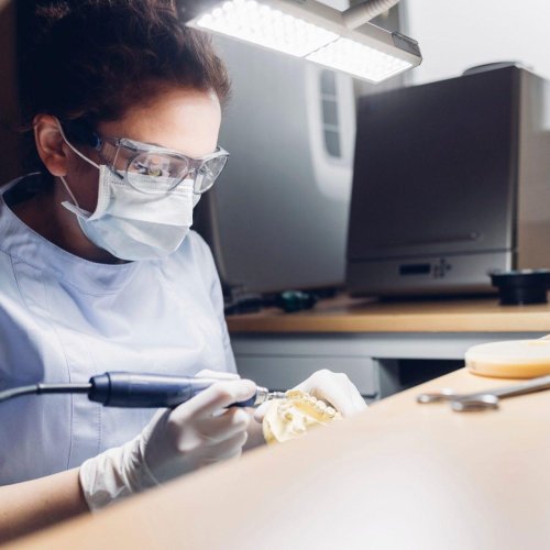 Dentures 15 dentist making denture in laboratory