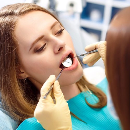 overview-of-dental-caries-prevention-woman-at-the-dentist-s-chair-during-a-dental-procedure–r8e7kd3mbic3lo95h59pxzmwuh82inb7zs8vhcbde0 dental cavities protection